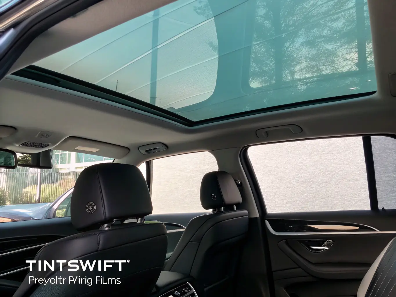 An image showing a car's interior with window tint, emphasizing the reduction in glare and heat, and the enhanced privacy it provides.